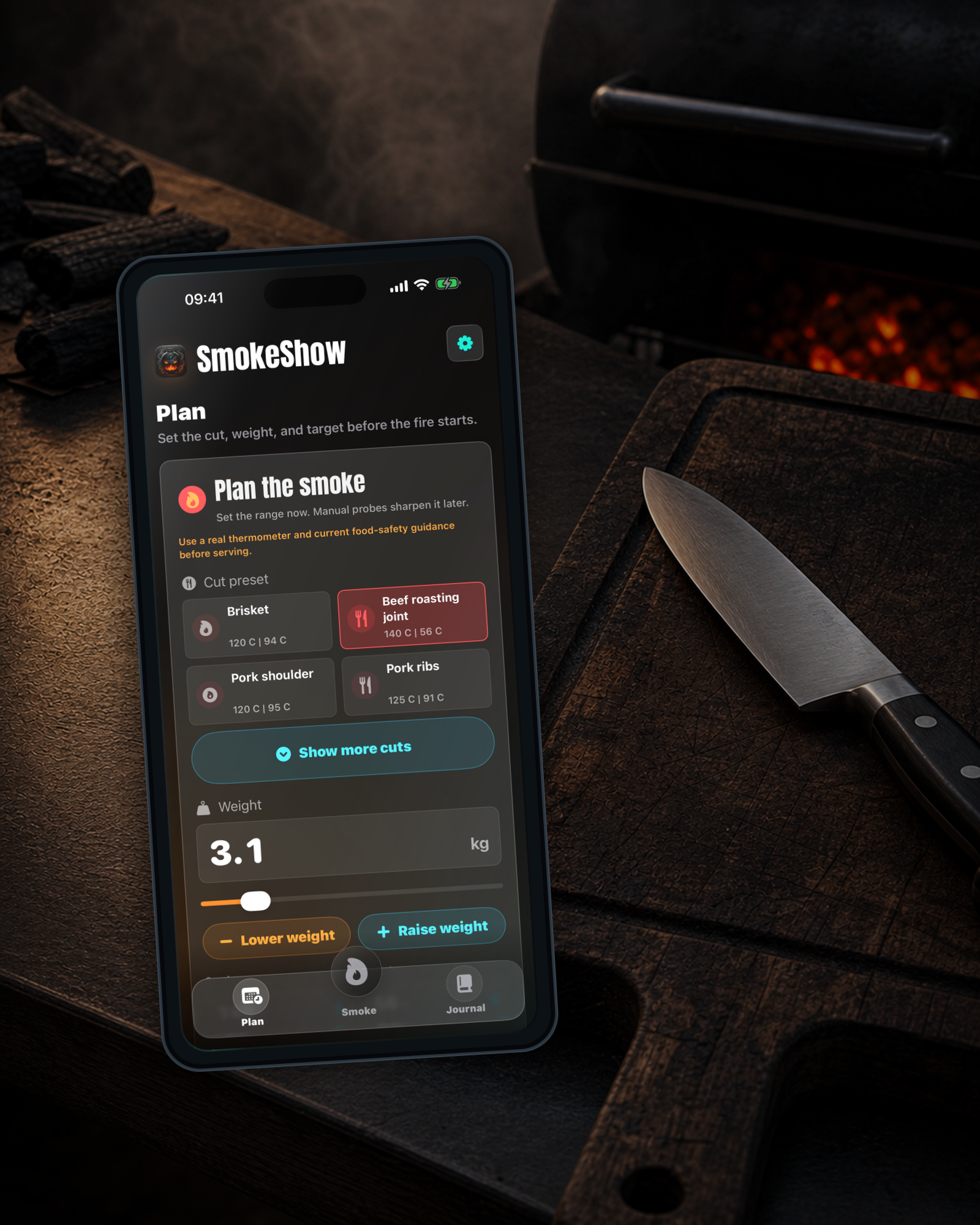 SmokeShow Plan screen beside a cutting board and chef knife on a smoker-side prep surface